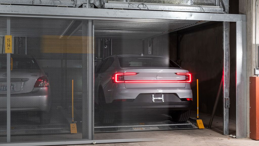 The car is parked on the platform in the parking system