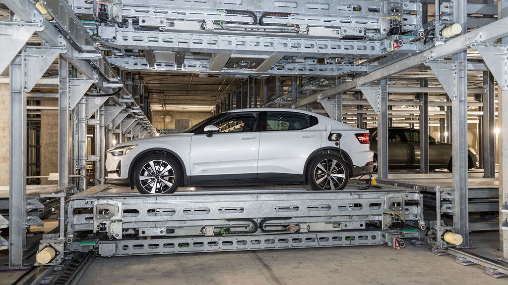 The car is parked on a parking platform within an automated parking system.