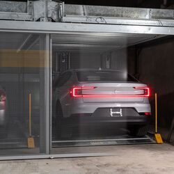 The car is parked on the platform in the parking system