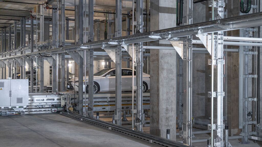 The car is being parked in an automated parking system.