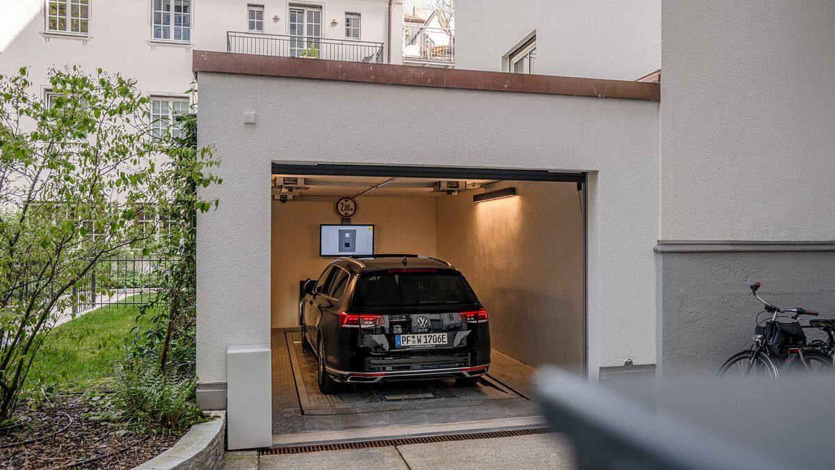 The car is parked in the garage entrance