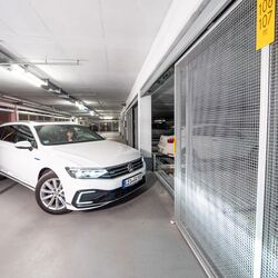 A person drives into a parking system